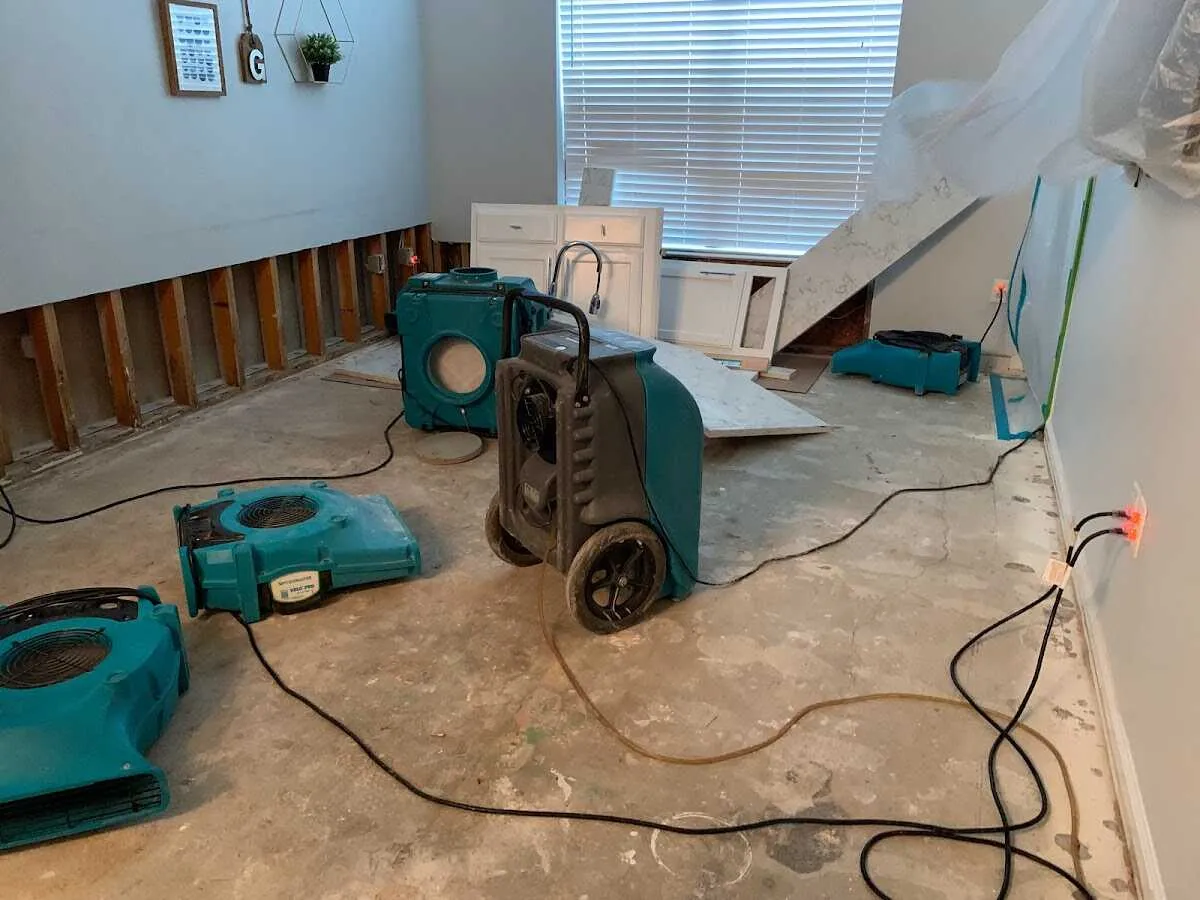 Dehumidifier in flood-cut room for Water Damage Restoration in Moraine